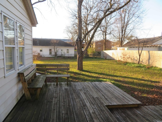 wooden deck with a yard