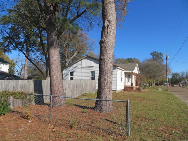 view of property exterior with a lawn