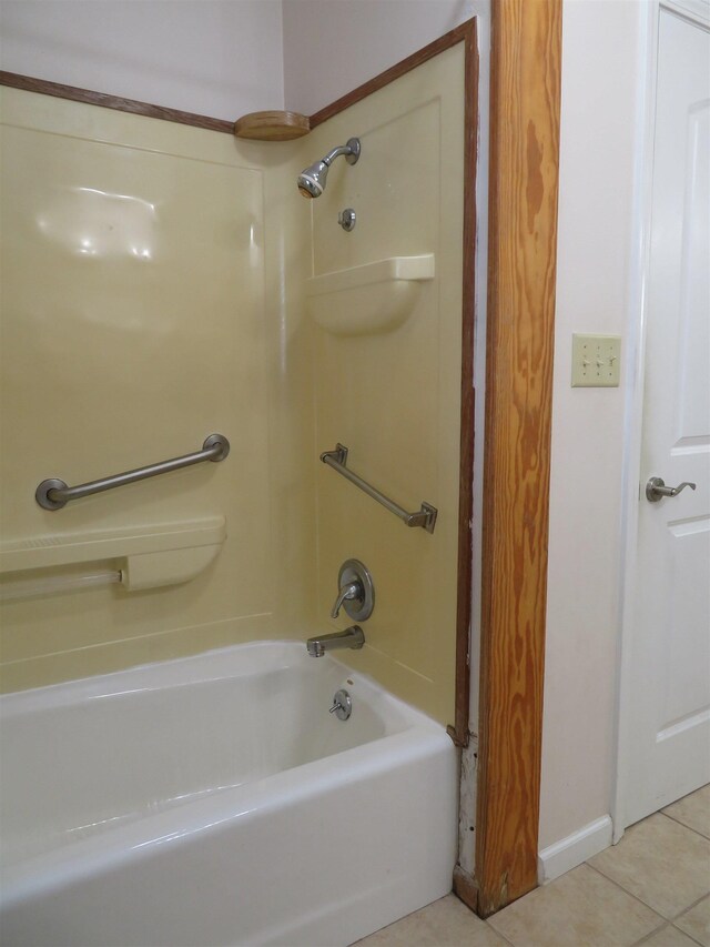 bathroom with tile patterned floors and  shower combination