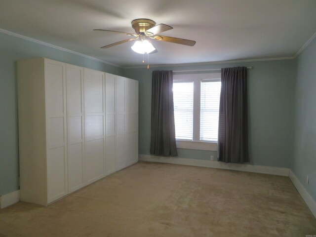 1124 Clinton St, Arkadelphia, AR 71923 - unfurnished bedroom with crown molding, light colored carpet, ceiling fan, and a closet