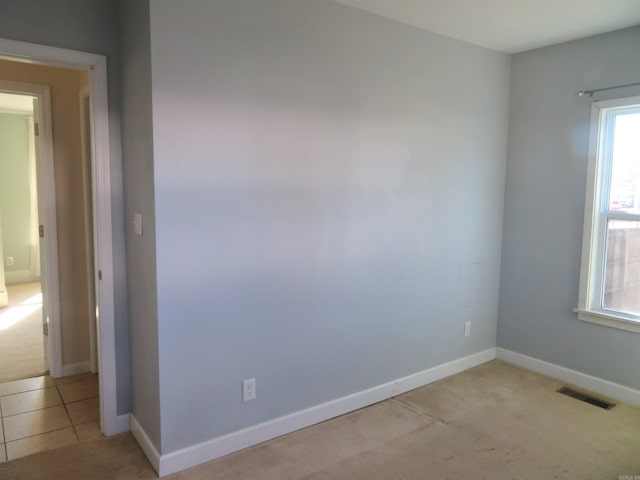 empty room with light colored carpet