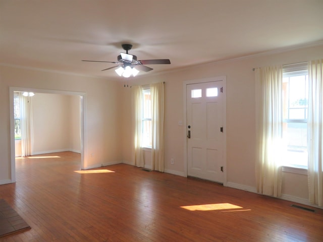 1124 Clinton St, Arkadelphia, AR 71923 - entryway with crown molding, a wealth of natural light, ceiling fan, and light hardwood / wood-style flooring