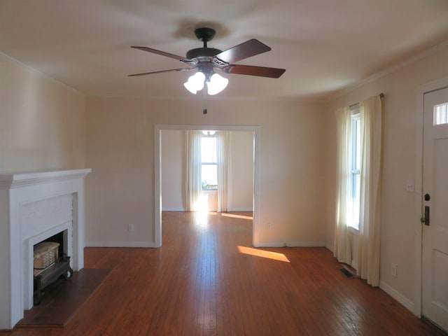 1124 Clinton St, Arkadelphia, AR 71923 - unfurnished living room with crown molding, dark hardwood / wood-style floors, and ceiling fan