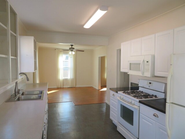 kitchen featuring white cabinetry, white appliances, dark wood-type flooring, and sink