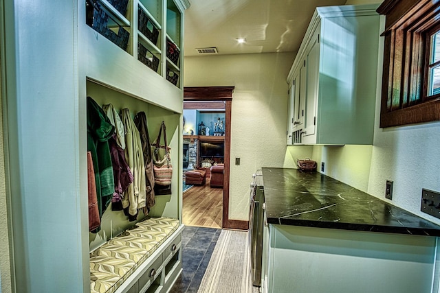 mudroom with dark wood-type flooring