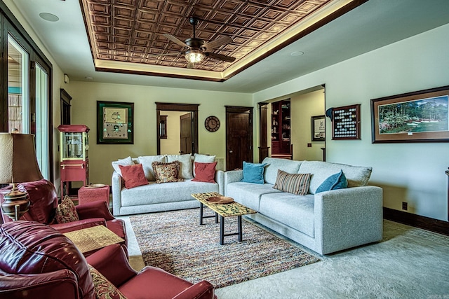 carpeted living room featuring ceiling fan