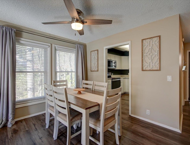 dining room featuring ceiling fan, dark hardwood / wood-style floors, and a textured ceiling