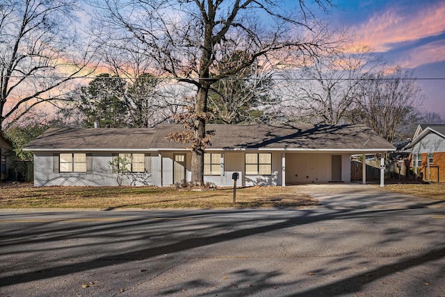 view of front facade with a carport