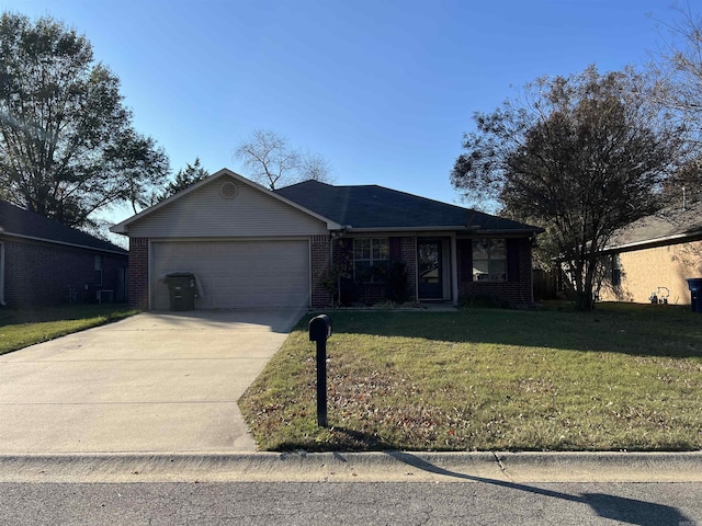 single story home with a garage and a front lawn