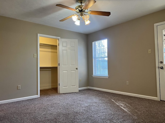 unfurnished bedroom featuring ceiling fan and carpet flooring