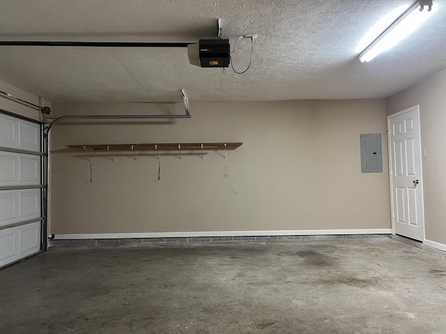 garage with a garage door opener and electric panel