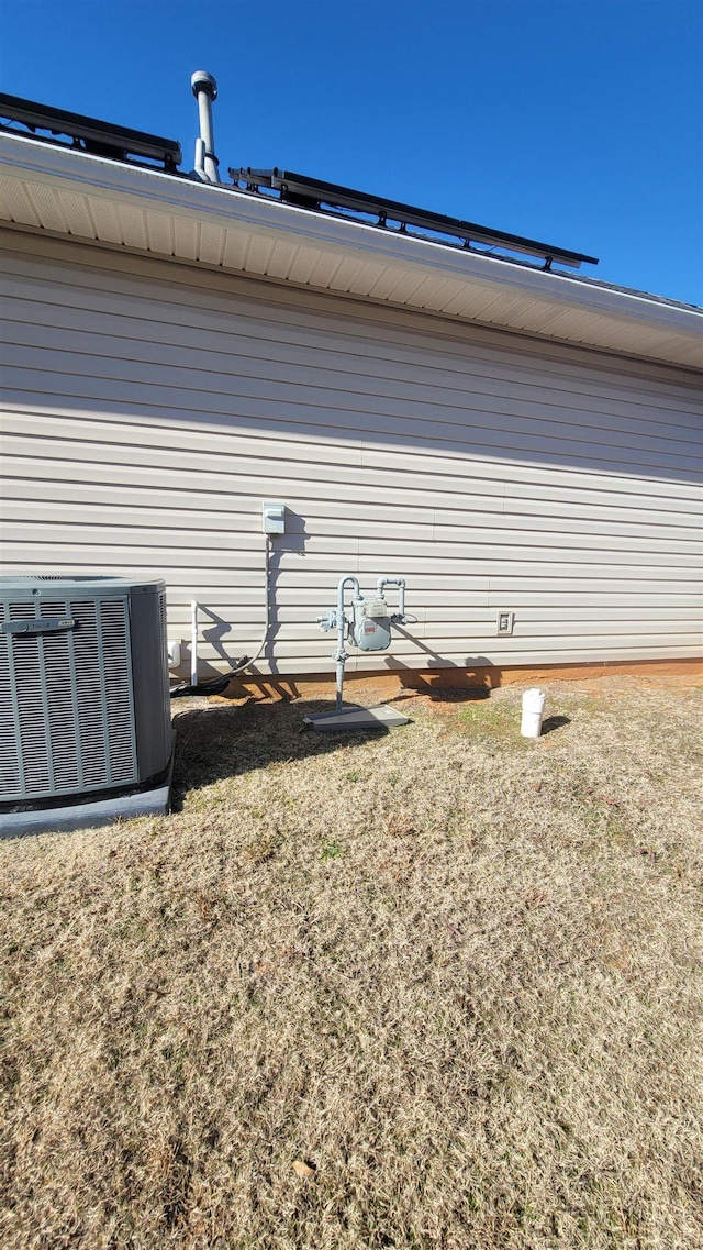 view of side of home featuring cooling unit