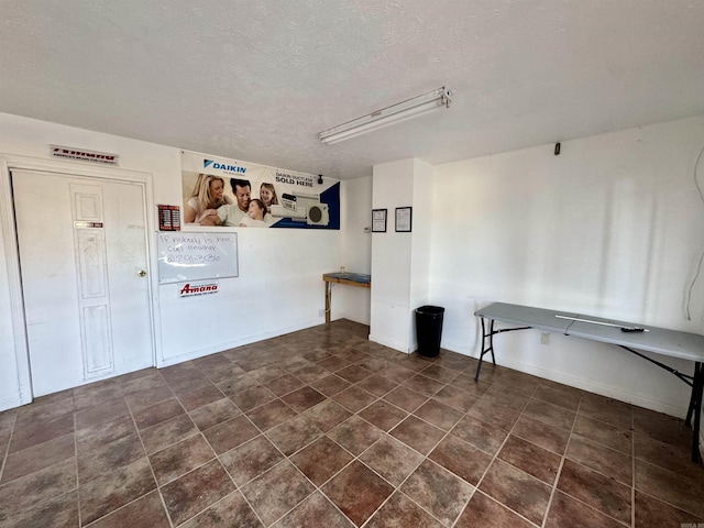 laundry area with a textured ceiling