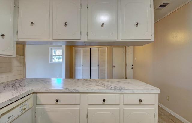 8 Woodmere Pl, Sherwood, AR 72120 - kitchen with light tile patterned floors, dishwasher, white cabinets, decorative backsplash, and kitchen peninsula