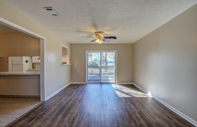 8 Woodmere Pl, Sherwood, AR 72120 - empty room with dark hardwood / wood-style flooring, ceiling fan, and a textured ceiling