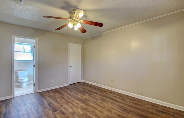 8 Woodmere Pl, Sherwood, AR 72120 - spare room with dark wood-type flooring, ceiling fan, and a textured ceiling