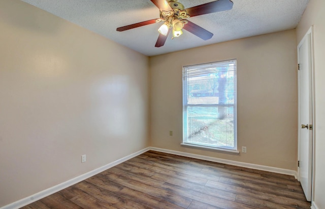8 Woodmere Pl, Sherwood, AR 72120 - empty room with ceiling fan, dark wood-type flooring, and a textured ceiling