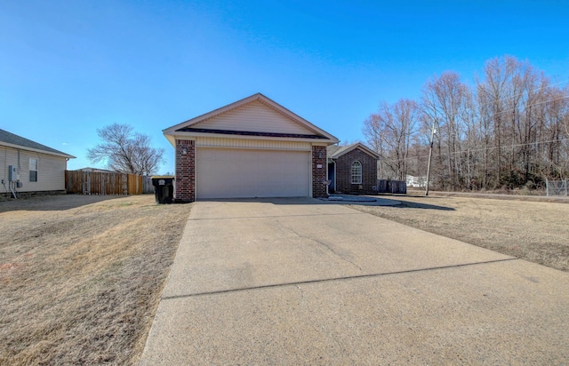 view of front of house featuring a garage and a front lawn