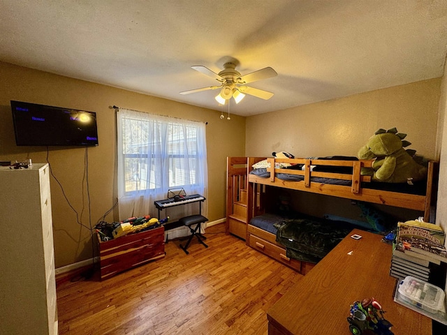 bedroom featuring hardwood / wood-style flooring and ceiling fan