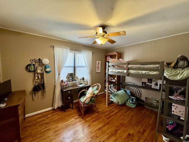 bedroom featuring hardwood / wood-style flooring and ceiling fan