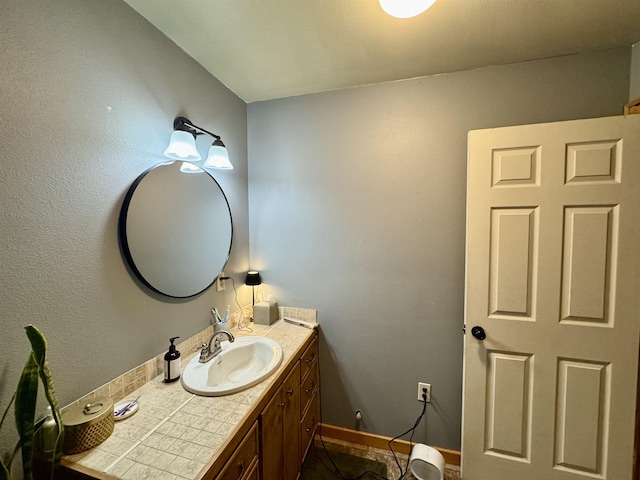 bathroom with tile patterned floors and vanity