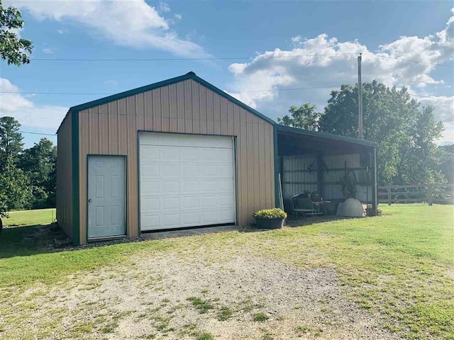 garage with a yard