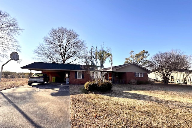 ranch-style house featuring a carport