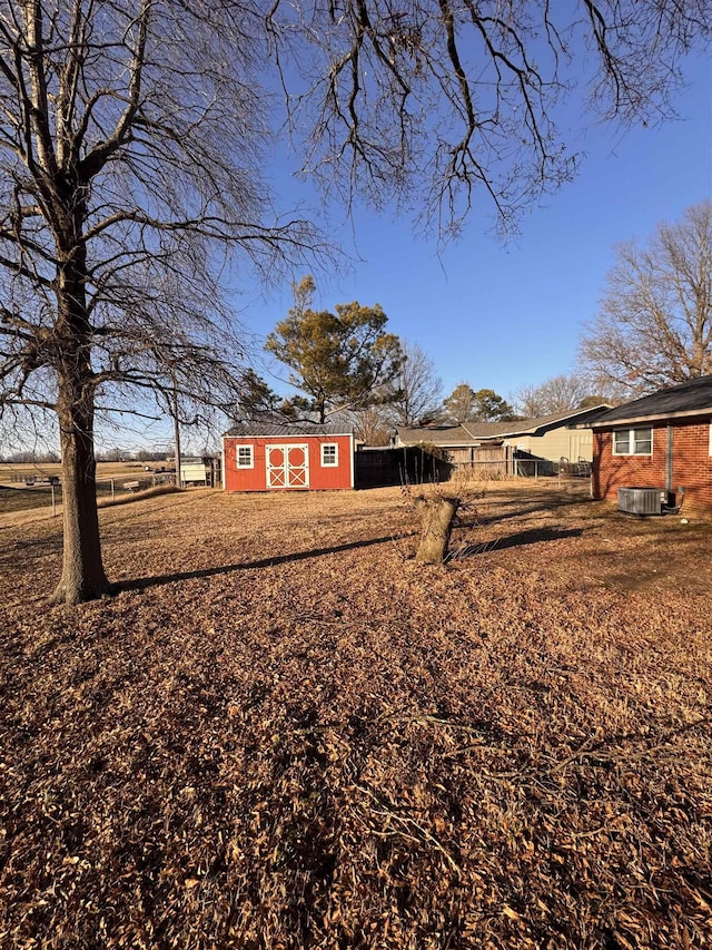 exterior space with a storage unit and central air condition unit