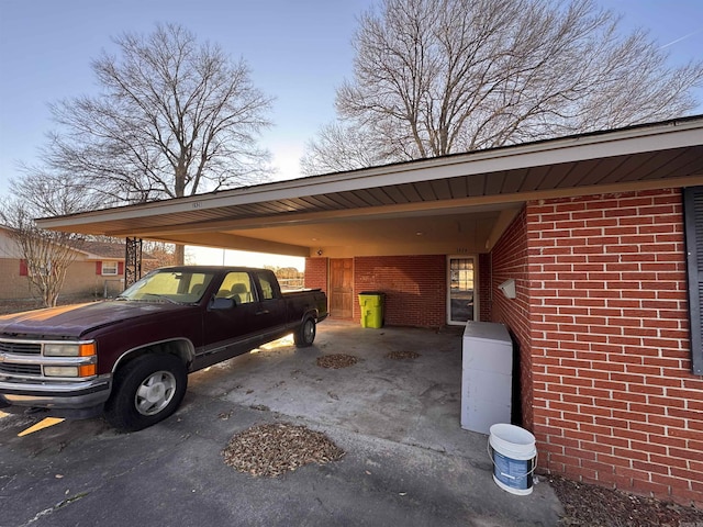 view of vehicle parking with a carport