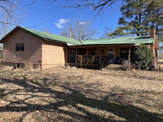 back of house with a porch