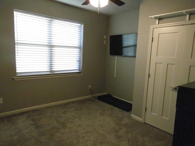 carpeted empty room with ceiling fan