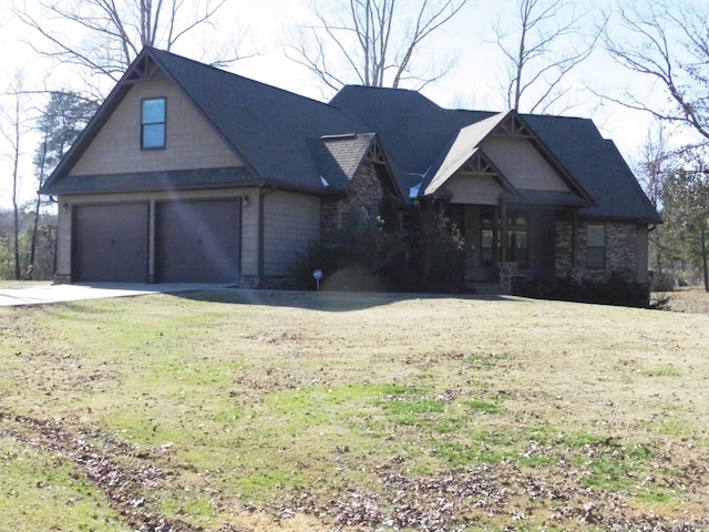 view of front of house featuring a garage and a front yard