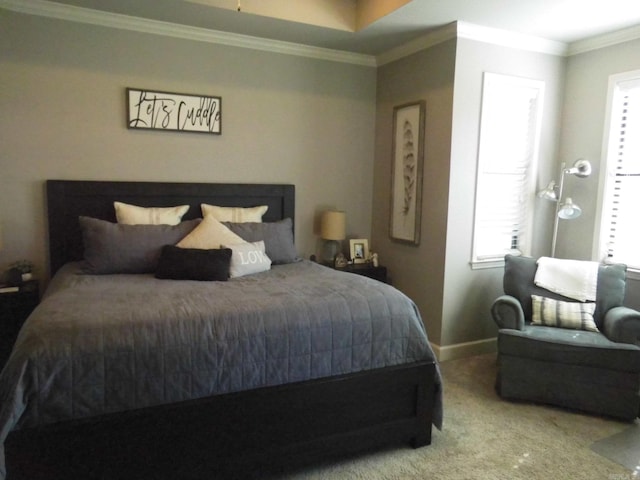 carpeted bedroom with multiple windows and crown molding