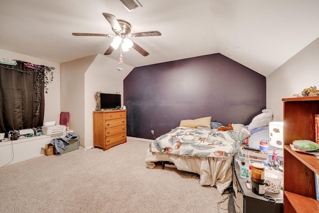 carpeted bedroom featuring lofted ceiling and ceiling fan