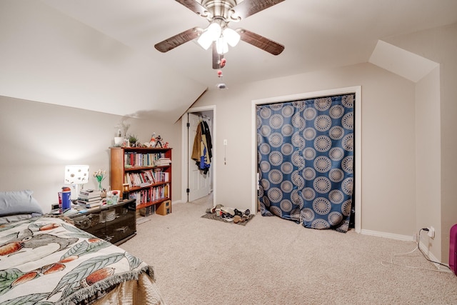 bedroom featuring vaulted ceiling, ceiling fan, carpet floors, and a closet