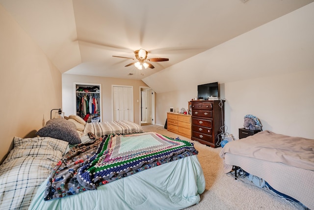 bedroom with vaulted ceiling, ceiling fan, and carpet floors