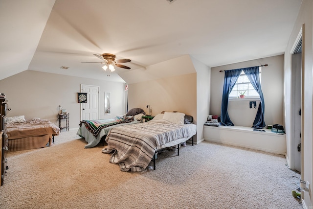 carpeted bedroom with lofted ceiling and ceiling fan