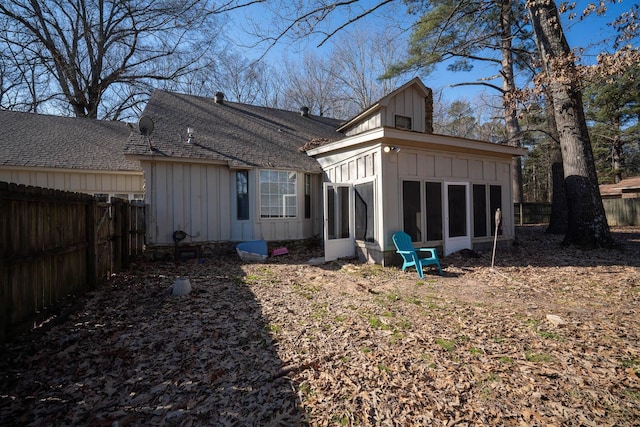 back of house with a sunroom