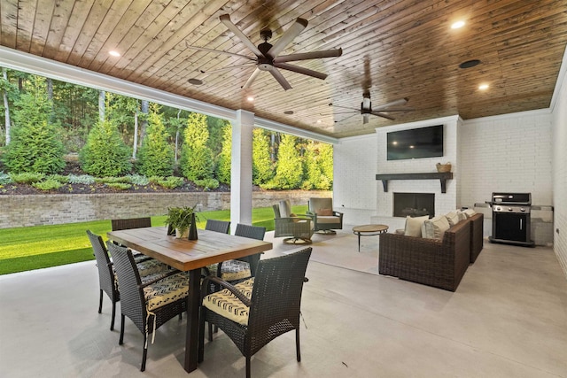 view of patio / terrace with a grill, an outdoor living space with a fireplace, and ceiling fan