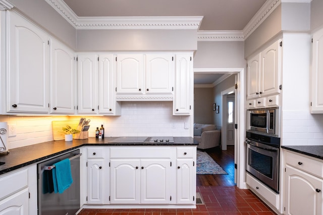 kitchen featuring white cabinetry, appliances with stainless steel finishes, and backsplash