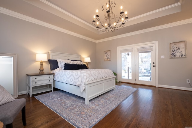 bedroom with a raised ceiling, a chandelier, access to exterior, and dark hardwood / wood-style flooring