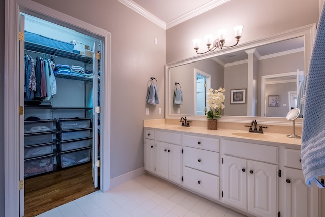 bathroom featuring crown molding, vanity, and tile patterned flooring