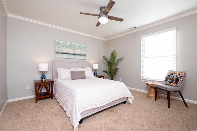 bedroom featuring light colored carpet, ornamental molding, and ceiling fan