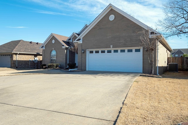 front facade with a garage and central AC