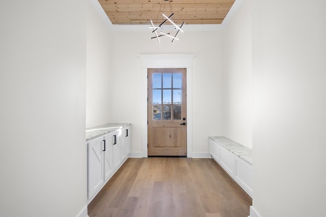 entryway with wood ceiling and light wood-type flooring