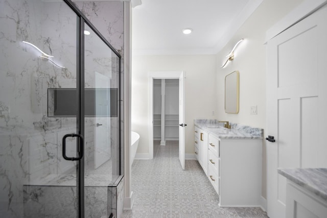 bathroom with ornamental molding, independent shower and bath, and vanity