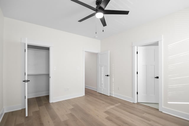 unfurnished bedroom with ceiling fan and light hardwood / wood-style flooring