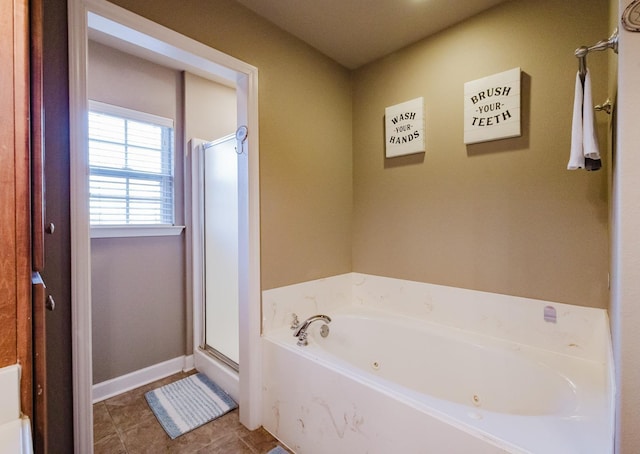 bathroom featuring plus walk in shower and tile patterned flooring