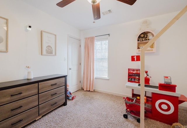 bedroom with ceiling fan and light carpet