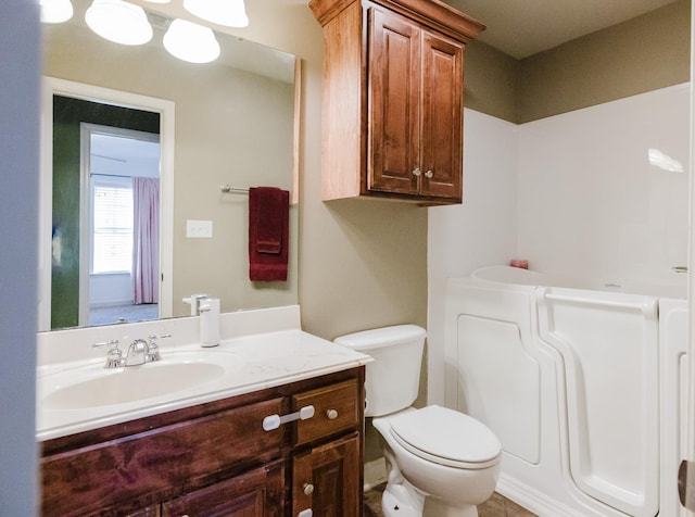 bathroom with vanity and toilet